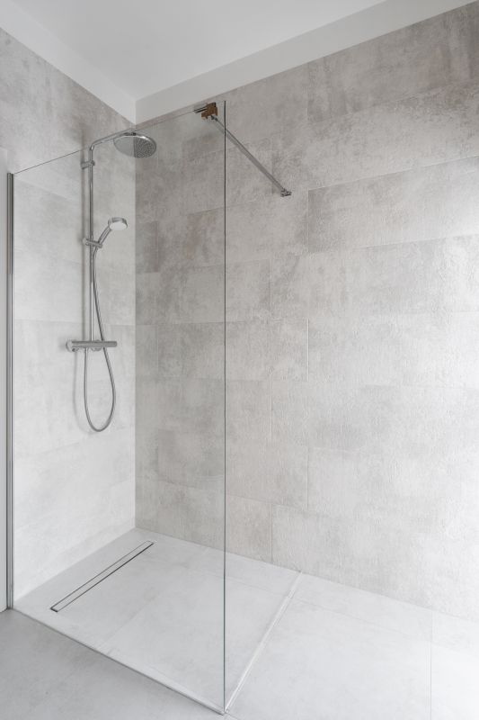 Walk-in shower with glass enclosure